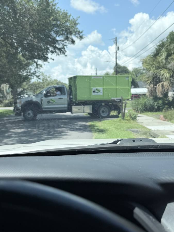 Bin There Dump That truck arriving with donated dumpster